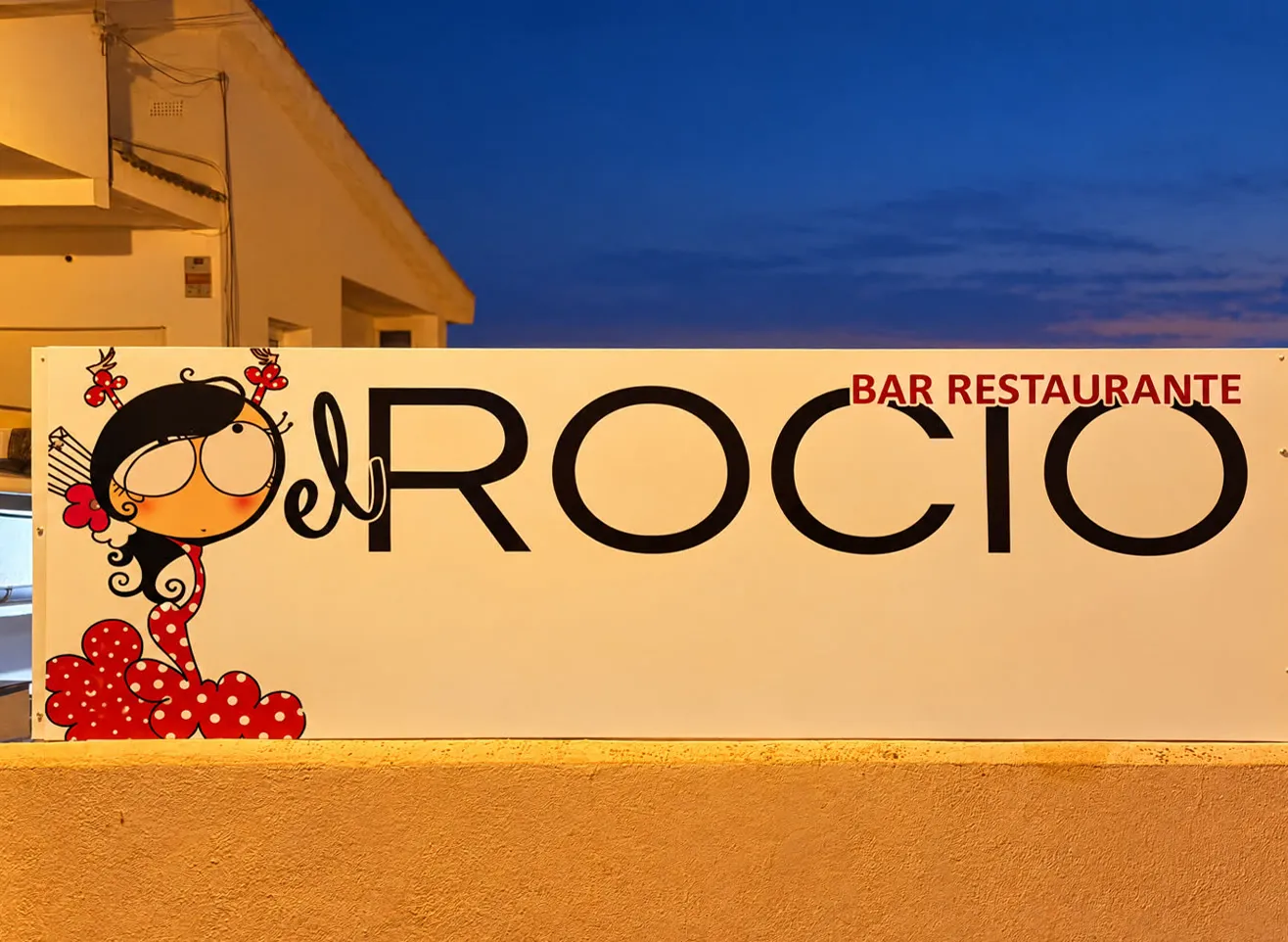 La lona de la flamenca de El Rocío, en Carrer Francesc Cambó